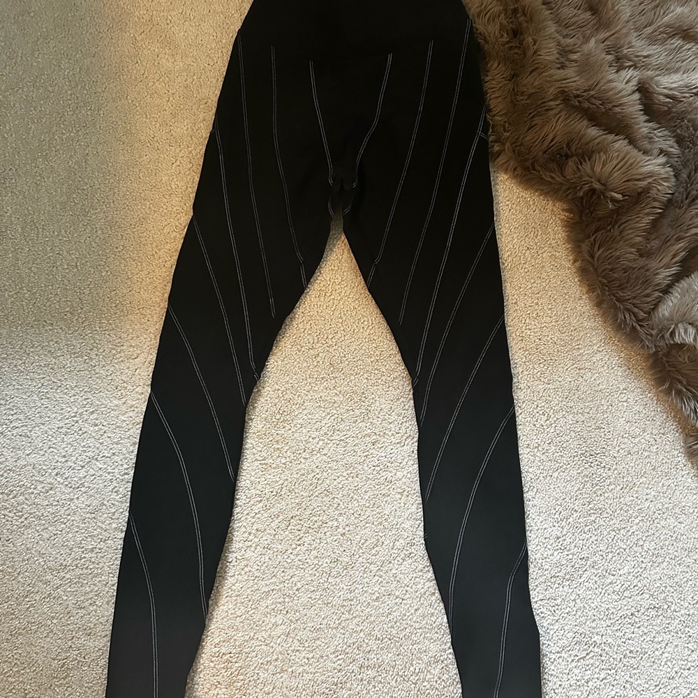 Alo Black Leggings with White Stripes as seen on Kylie Jenner